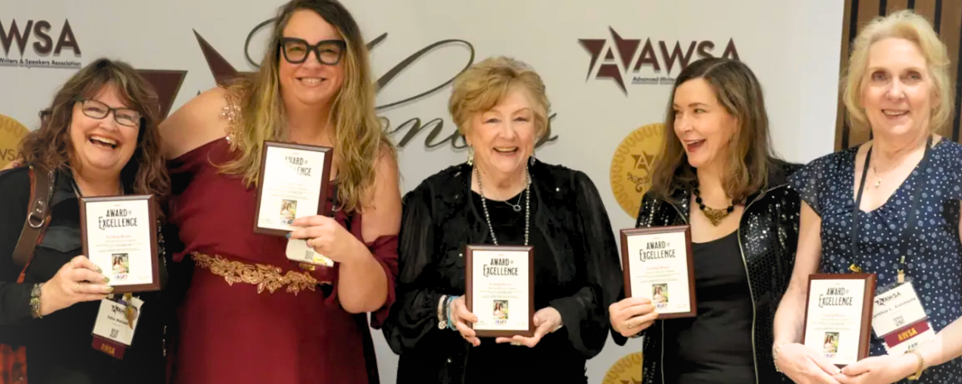 Five women holding Christian Market Book Award plaques
