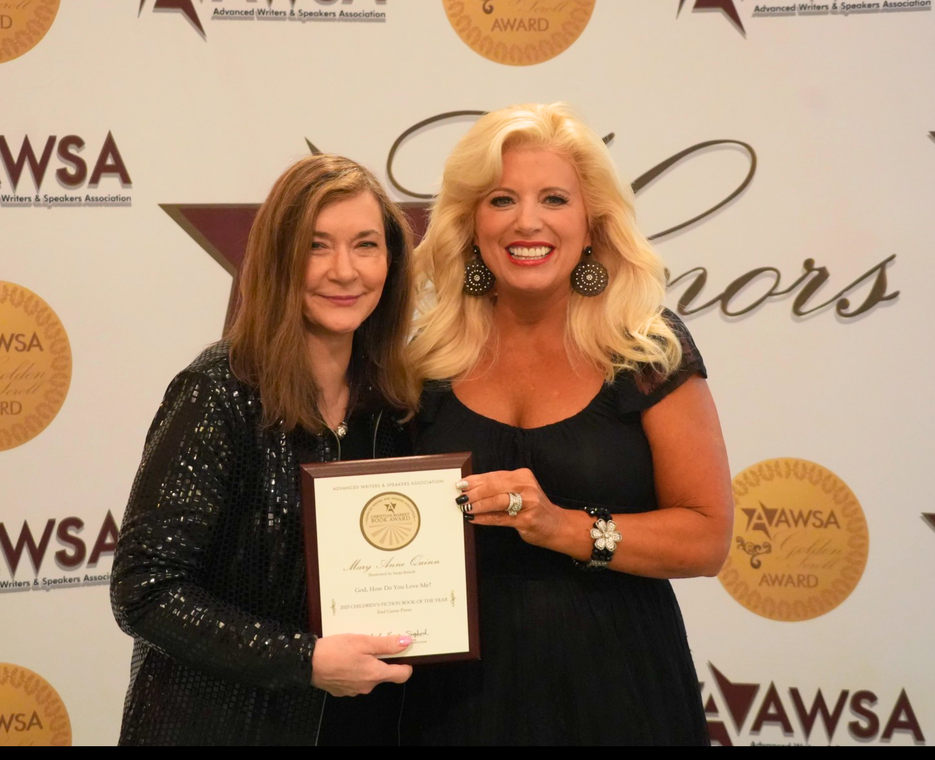 Two women with a 2024 Member of the Year plaque