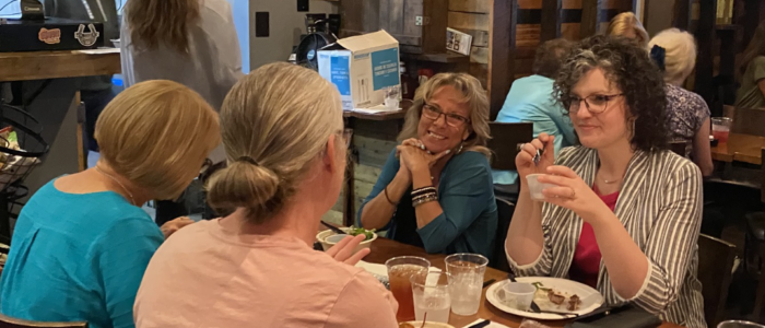 AWSA members laughing together over lunch