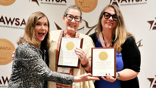 Lisa Burns and Amber Weigand-Buckley receiving the 2024 Anthology of the Year award
