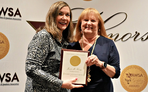 Janet McHenry receiving the 2024 Bible Study Book of the Year award
