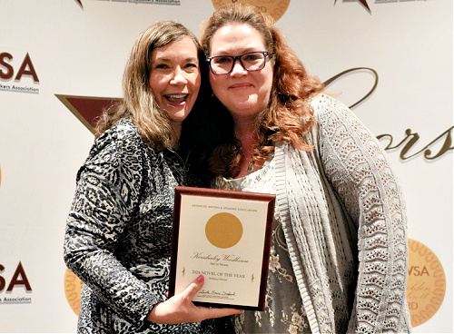 Kimberley Woodhouse receiving the 2024 Golden Scroll Novel of the Year award
