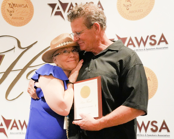 Pam Farrel and Bill Farrel receiving the 2024 AWSA Impact Award